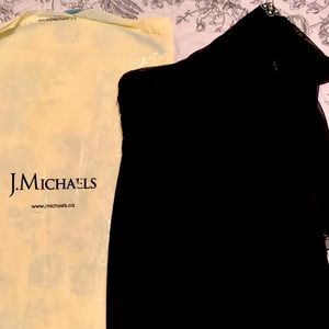 Beautiful black cocktail dress with brooch.